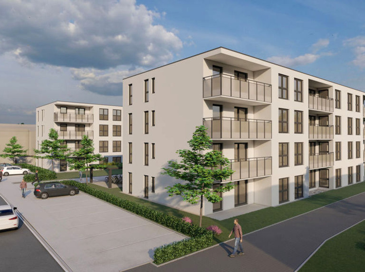 Wohnhaus mit Grünanlage und Parkplätzen